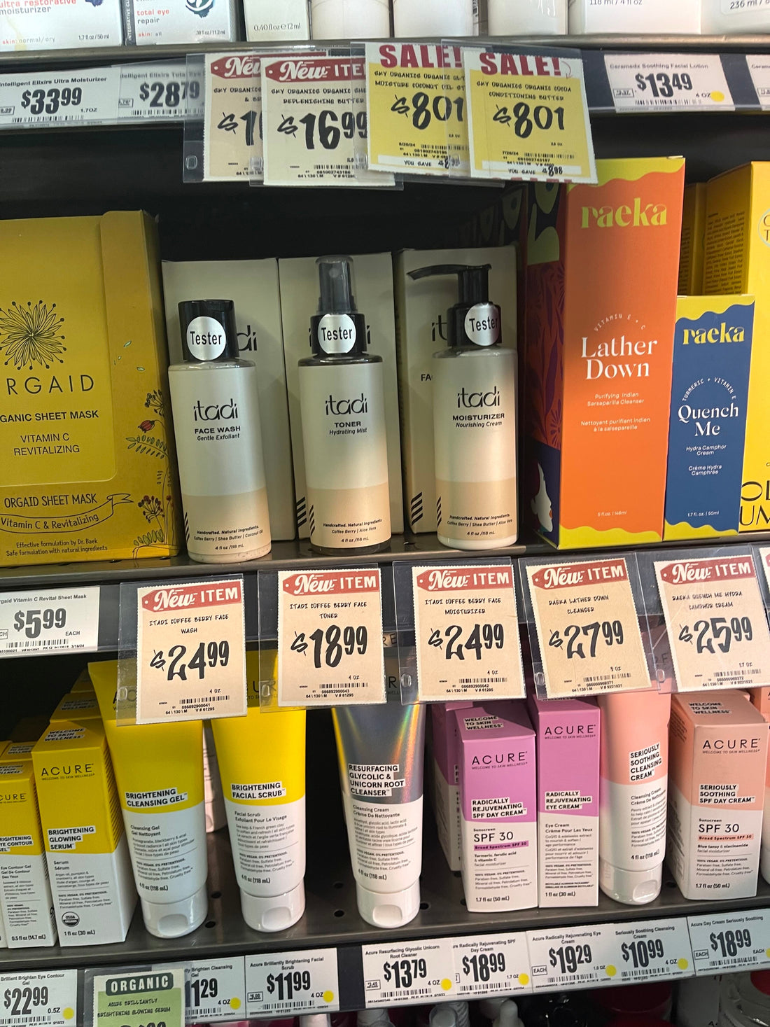 Three ITADI bottles tagged as new items on a Central Market shelf in Dallas, beside Orgaid and Acure products